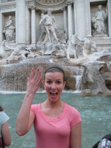 Ann Taylor tosses a coin into Trevi Fountain
