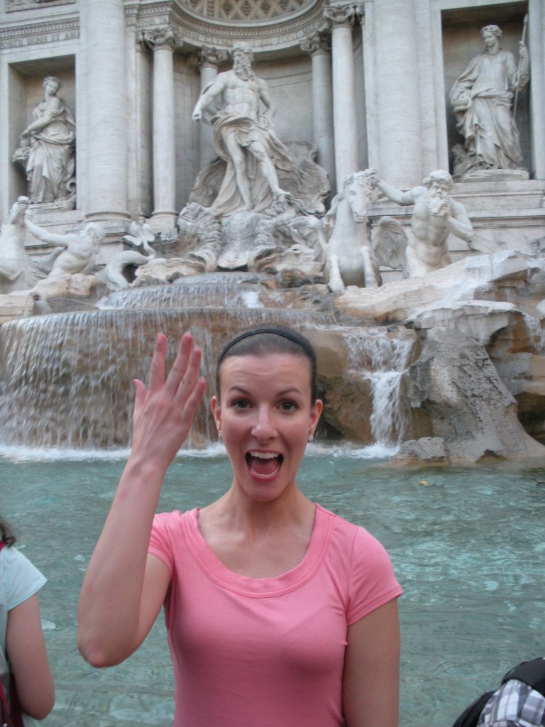 Ann Taylor tosses a coin into Trevi Fountain