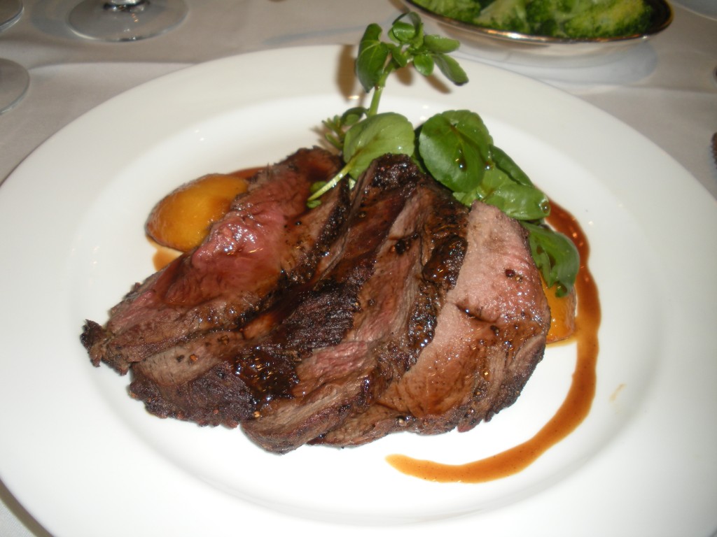 Peppered rump of roe deer with candied apple and watercress