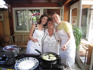 Ann Taylor, Angela and Dan pause for a picture while frying zucchini flowersa