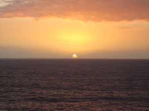 The sun sets over the Pacific Ocean